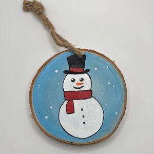 Handcrafted Snowman Ornament with Blue Background